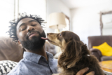 How to Stop a Dog From Licking You (and Why They Do It)